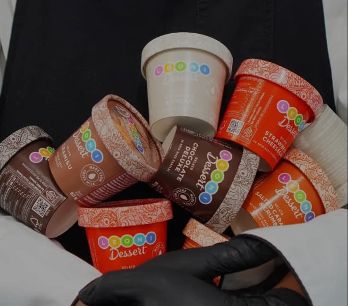 Leoni gelato sticks enjoyed by a family outdoors