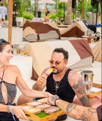 Man enjoying a gelato bar at a beach cabana