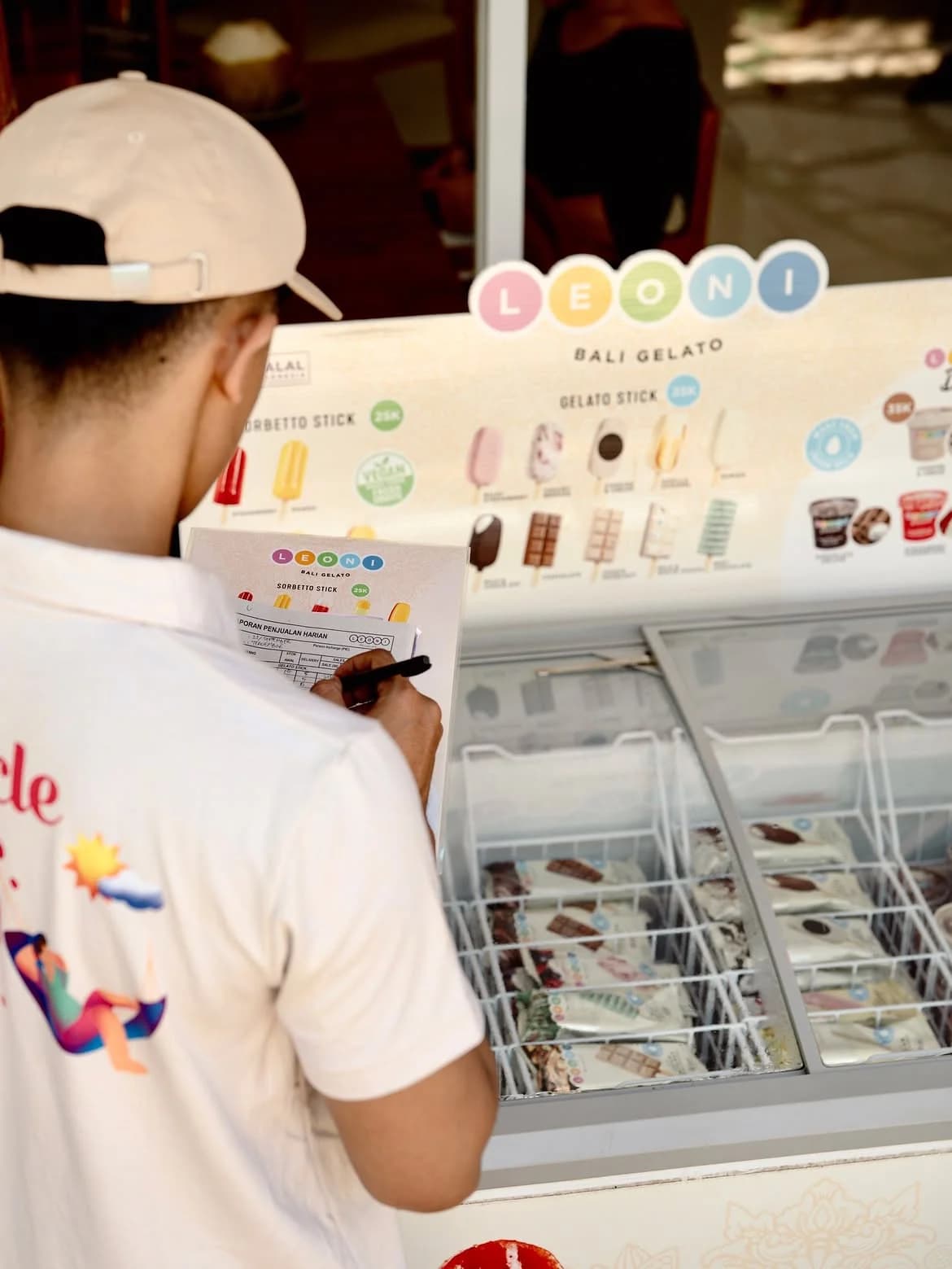 Leoni staff checking stock at a partner freezer