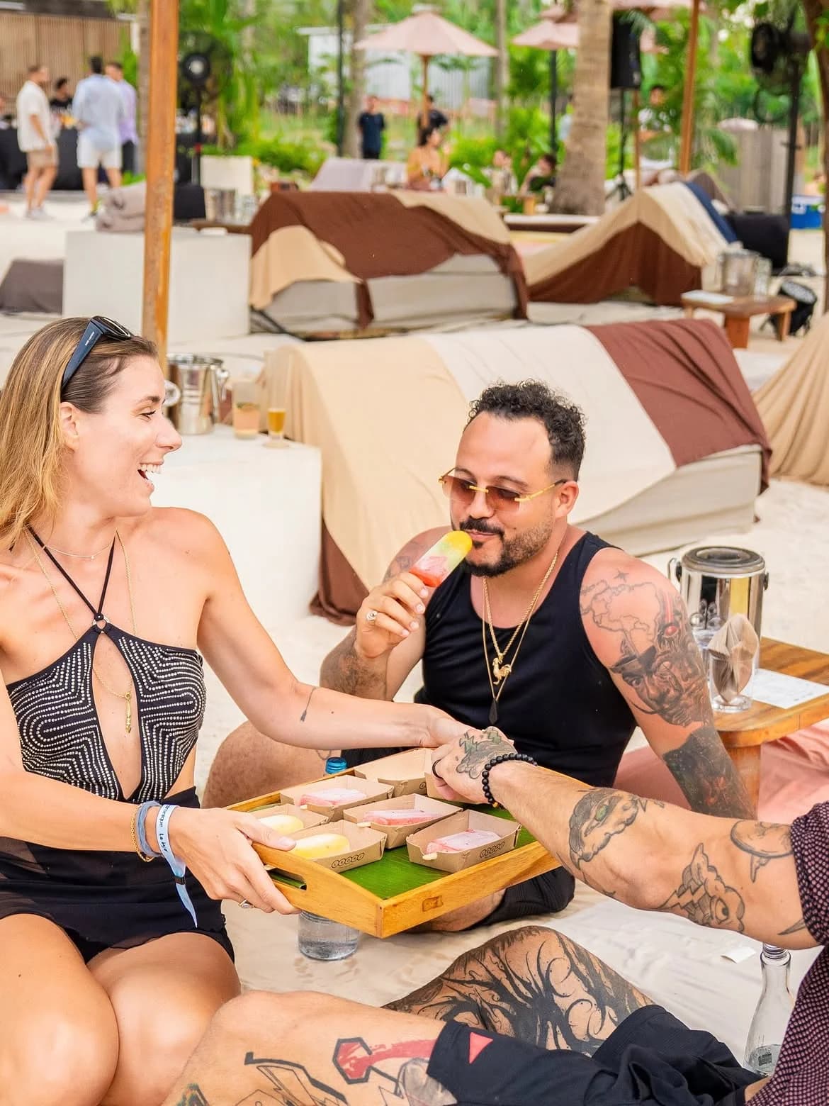 Friends sharing a Leoni gelato tasting tray outdoors